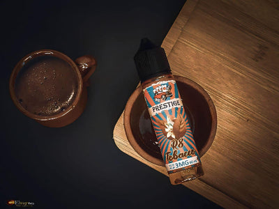 Prestige e-liquid bottle on a wooden surface with a dark background