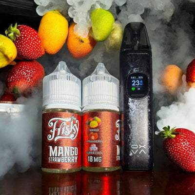 Two bottles of 'The Hfisky' Mango Strawberry vape juice with a vaping device and fruit in the background.