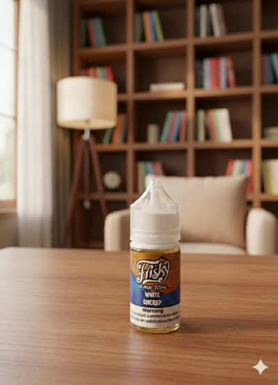 Fiji's White Cherry vape juice bottle on a table with a bookshelf in the background