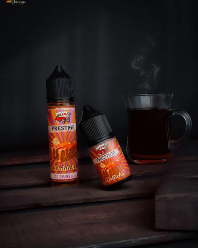 Two bottles of Prestige Dolitcha vape juice with a smoking cup on a dark background