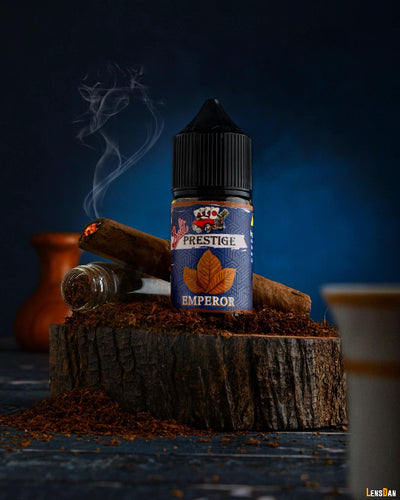 Prestige Emperor vape juice bottle on a wooden block with smoking elements