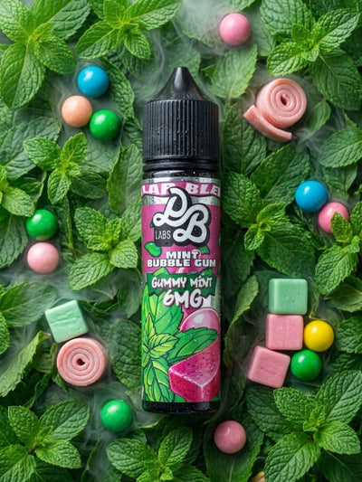 A bottle of Lab Glee Labs Mint Bubble Gum Gummy Mint 6MG e-liquid is centered on a bed of fresh mint leaves with colorful gummy candies scattered around it.