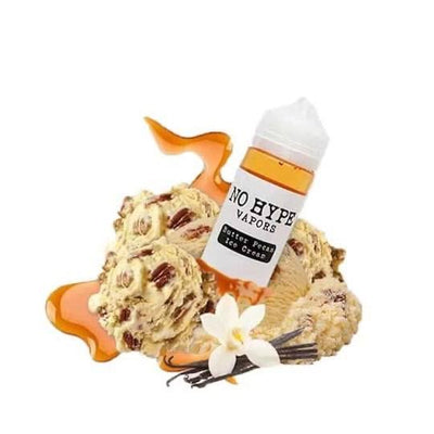 A bottle of No Hype Vapors dessert press ice cream e-liquid flavor, styled with vanilla ice cream scoops, caramel drizzle, and a vanilla flower on a white background.